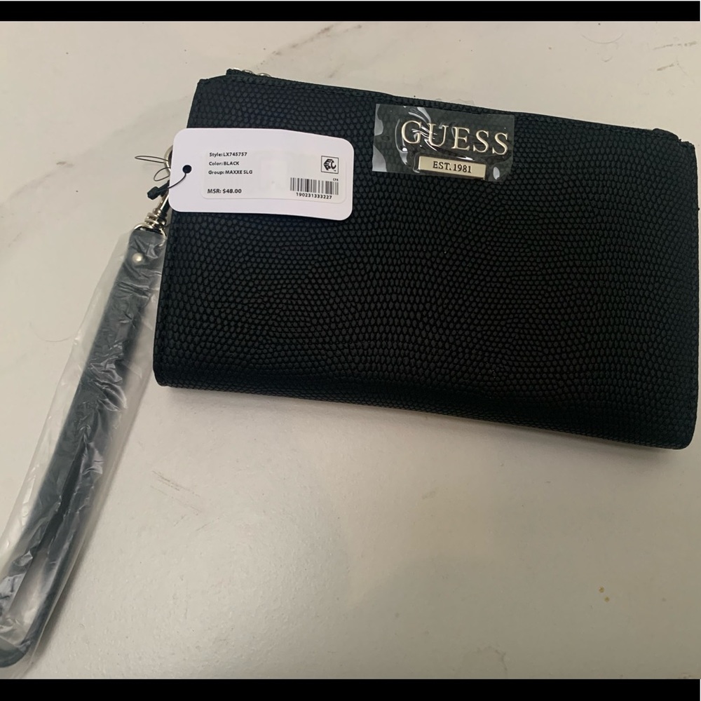 New Guess wristlet in box with tags.